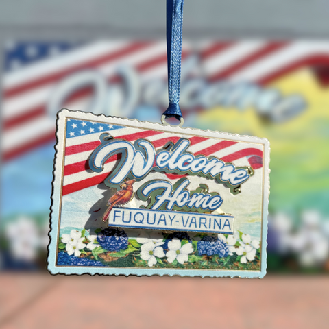 Decorative ornament with 'Welcome Home Fuquay-Varina' text on a colorful background
