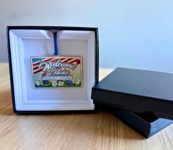 Decorative ornament with 'Welcome Home' text and navy box